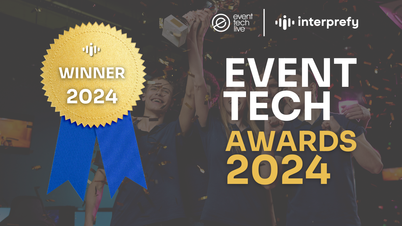 Interprefy logo next to the Event Tech Live logo with 'EVENT TECH AWARDS 2024' text. A gold medal with the Interprefy logo and 'WINNER 2024' text is displayed to the left. The background shows people celebrating the win.